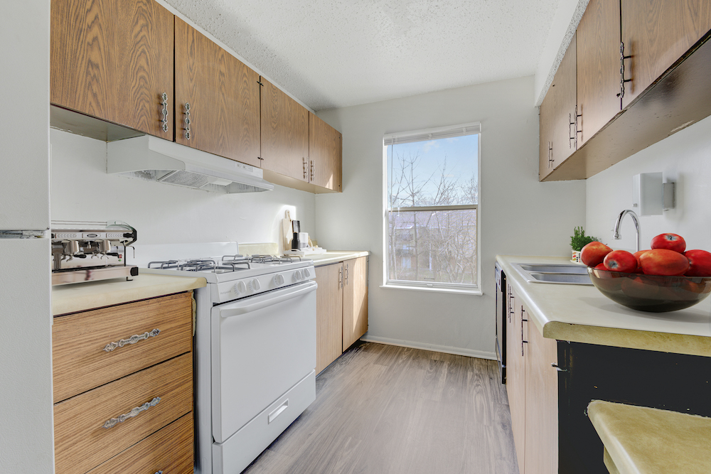 kitchen with white range and bright window